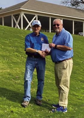 Cypress Bend General Manager Randy Rolland (right) presents TBLA BU Chair Ted Dove with certificates for a golf one year membership to the newly renovated golf course and two golf/accommodation weekend packages that will be auctioned at the Bass Unlimited Banquet. Photo Submitted