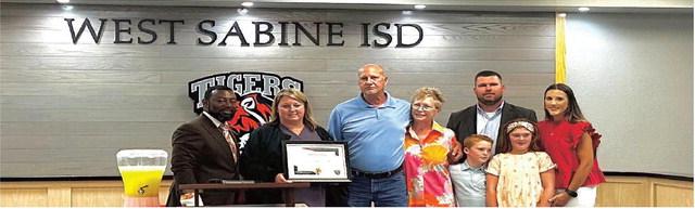 Dr. Gilder, Superintendent, Lisa Lane, School Board President and members of the Leath Family. see page 2 for more
