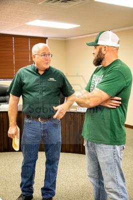Mott and Beall discuss the process of crushing brick and mixing in Hornet Green!
