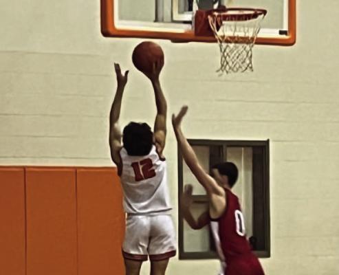 West Sabine G Tyler Streigel sticks in two points against Colmesneil January 20 in Pineland. Reporter photo by Cecil Tatom