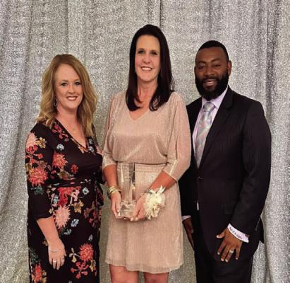 Gala... Low Excellence in Education Award winner, Melissa Lane pictured with West Sabine Elementary Principal Kenna McLenny (r) and Superintendent Dr. Carnelius Gilder.