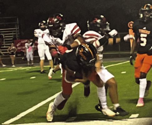 Senior Night... Senior QB Laken Quick takes on two would be Hull-Daisetta tacklers October 17 in Pineland.