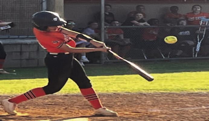 Rip it... Lady Tiger K.K. Garza lines an RBI single in game two of West Sabine’s bi-district series vs. Woden.