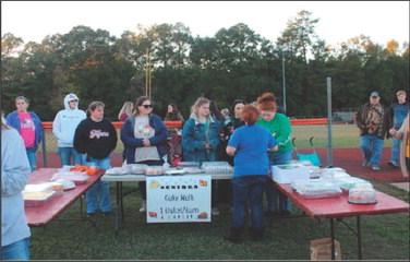 West Sabine Seniors cake walk was just one of the many booths at the WSISD Fall Fair held at the football field Thursday evening. There were lots of prizes for the kids to win and snacks to eat. You know you are in the pineywoods when one of the booths consisted of a toilet seat, complete with the lid, set up on a bench, and one ticket got you two chances to stand back a few paces and successfully toss a roll of toilet paper into the toilet seat to win a goldfish! Reporter photo by Kenny Wick
