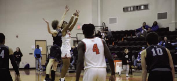 Tigers Fight Hard... Tiger Jakorian Walker and Lady Tiger Isis Diaz work hard to put points on the board. Reporter photo by Samantha Hill