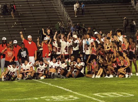 Tigers take home trophy... The West Sabine Tigers retained the PineCone Bowl trophy, defeating the Hemphill Hornets 56-14 on September 11 in Hemphill.