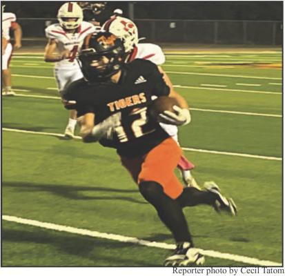 12 Rumblin9 in for six... Tiger RB Kameron Striegel rumbles in for one of his three scores against Colmesneil October 11.