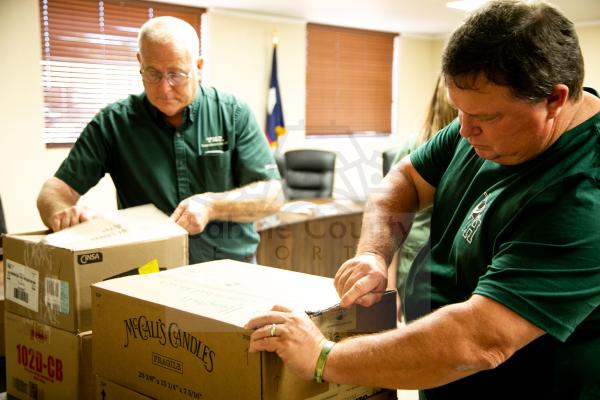 Mott and English begin opening the boxes of the Old Gym Knives.