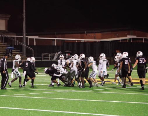 #25 Timber Strickland and #44 Brevin Rushing team up to bring down Wildcat RB #20 Tesean Hamilton in 2nd quarter action
