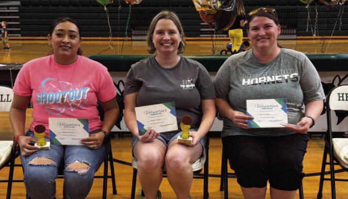 Shout OUT. .. Top 3 Volunteers for Hemphill Little Dribblers progra am were recognized in closing cered Michel Garig monies left to right Aurora Rosas, AmberMcGee, and