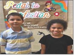 Two Hemphill Elementary students received bicycles from the Pedal to Perfection program for the third six weeks perfect attendance drawing. Pictured above are: Adan Arce and Haizlee Meshell