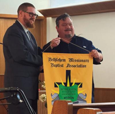 Mission rally... Yellow Ridge Missionary Baptist Church, located off FM 705 between Pineland and Broaddus, received the attendance banner at the Bethlehem Missionary Baptist Association's monthly mission rally on Friday, March 13, 2026, hosted by Kirbyvlle MBC. Kirbyvlle's pastor, Bro. Clint Mitchell, left, presented the banner to Bro. Melton Sims, right, the Yellow Ridge pastor. The next mission rally is set for April 10, 2026, at Nedville MBC. photo submitted