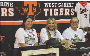 West Sabine Tiger Cora Sepulvado (c) signed her Letter of Intent to attend Southwestern University (Georgetown, TX) to play softball for the Division III Pirates while working toward a degree in Nursing. She is flanked by her mother, Holly Pitre (r) and Coach Crystal Muncrief. The signing was witnessed by numerous family members, her coaches, team mates, fellow West Sabine athletes and students, teachers, and administration. Reporter photo by Bill Dodson