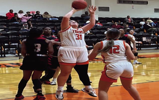 Reporter photo by Cecil Tatom With the stick back… Senior Lady Tiger Emma Bennett scraps for the ball and sticks back in for two January 30 vs. San Augustine.