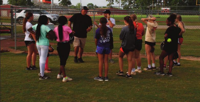 Welcoming alumni softball coach...